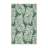Tocorico Jacquard Jungle Rug in green and white, featuring a bold leaf pattern woven in polypropylene, shown flat on a plain background.
