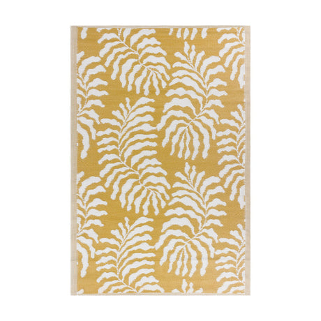 Tocorico Jacquard Jungle Rug in mustard yellow with white fern leaf pattern, flat-woven polypropylene with a matt finish, shown on a plain white background.