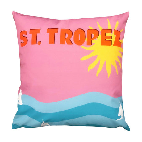 Square polyester cushion in pink, orange and blue with a bold "ST. TROPEZ" print, sun rays, wavy sea and sailboats, shown on a white background.