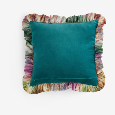 Trueno Velvet Cotton Cushion in teal, square shape with a solid matt velvet face and a printed multicoloured frill trim in plum, sage and amber tones, shown on a plain white background.