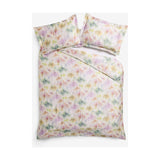 Trueno Cotton Abstract Duvet Cover Set in multicolour, with pink, purple, green and gold watercolour brushstrokes on cream cotton, styled with matching pillowcases on a white background.