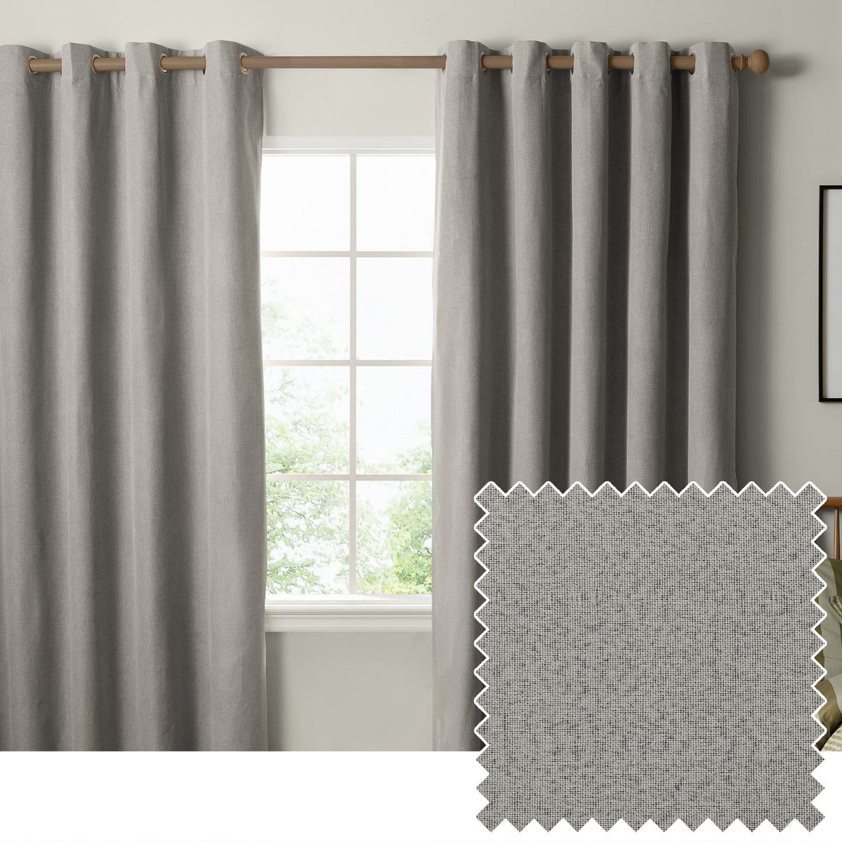 The Ultimate Blackout Plain Woven Eyelet Curtains in grey hang from a wooden pole either side of a window, with a woven fabric swatch shown inset.