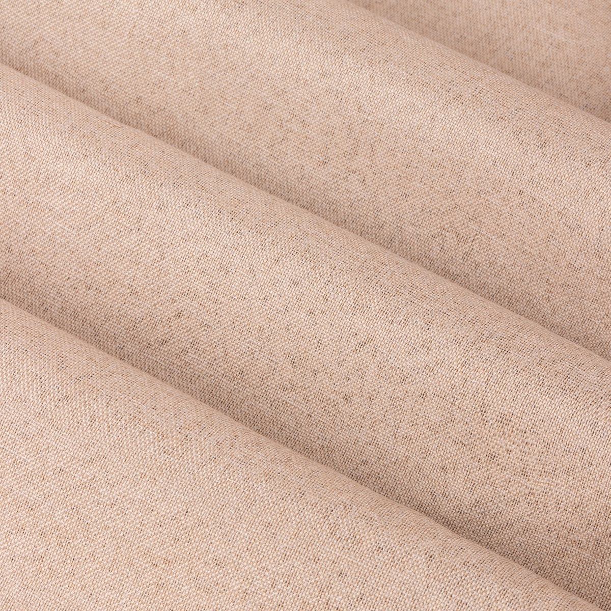 Close-up of The Ultimate Blackout Plain Woven Eyelet Curtains in blush pink, showing the mottled woven polyester fabric texture in soft folds.