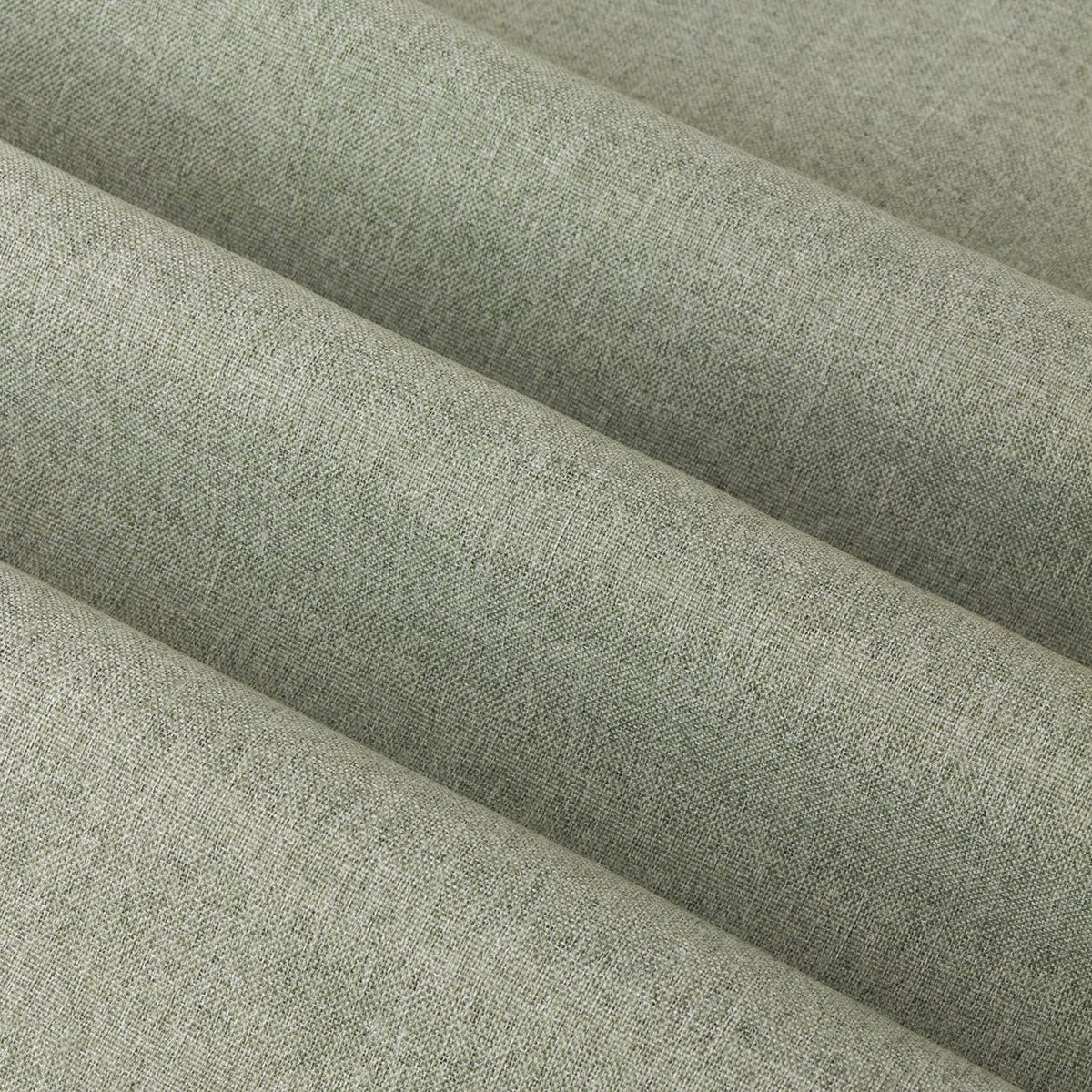 Close-up of The Ultimate Blackout Plain Woven Eyelet Curtains in sage green, showing the folded textured polyester fabric with a flecked weave finish.