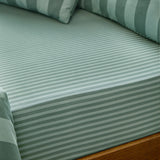 The Ultimate Stripe Cotton Blend Fitted Sheet in peppermint, shown fitted on a bed with matching striped pillows, showing the tonal stripe pattern and fabric texture.