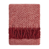 Tweedie Herringbone Polyester Throw folded flat, showing pink and burgundy chevron weave with a burgundy tasselled fringe on each end, set against a plain white background.