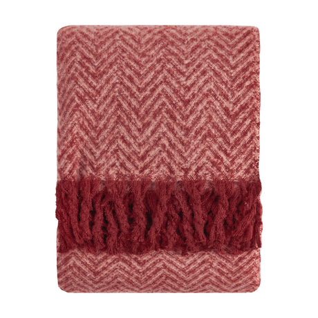 Tweedie Herringbone Polyester Throw folded flat, showing pink and burgundy chevron weave with a burgundy tasselled fringe on each end, set against a plain white background.