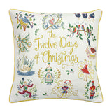 Square cream cushion embroidered with "12 Days of Christmas" motifs in gold script, multicoloured birds and figures, finished with a gold piped edge on a white background.