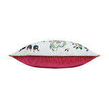 Side view of the 12 Days of Xmas Embroidered Velvet Cushion, showing cream front with festive embroidered motifs, gold piped edge, and pink velvet back, on a plain white background.