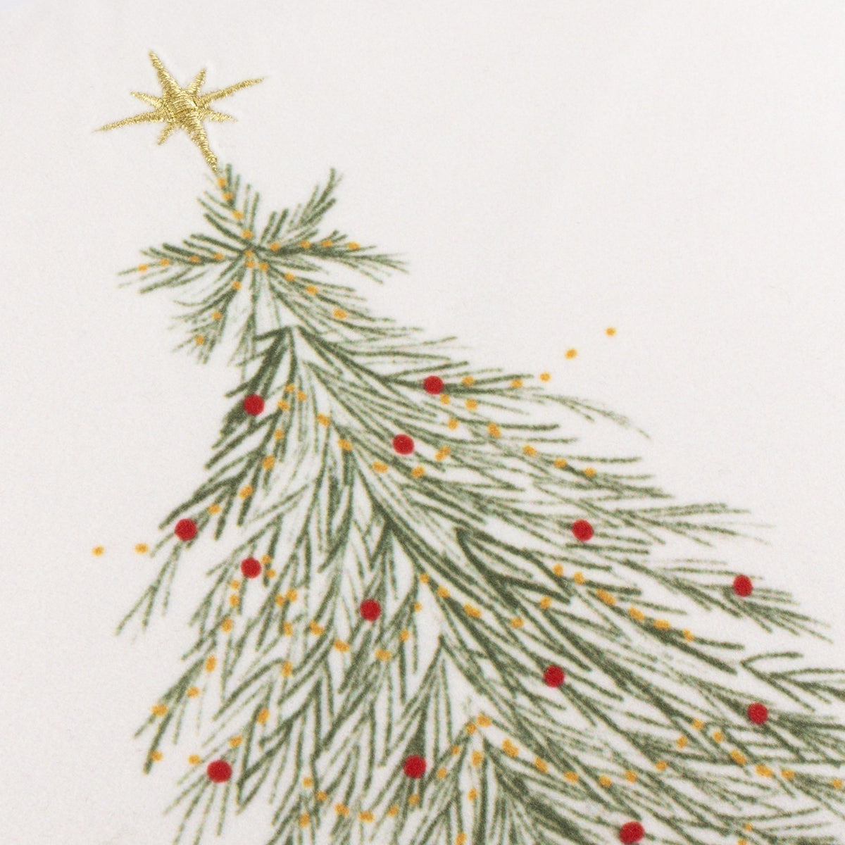 Close-up of the Twinkling Tree Woodland Velvet Cushion showing an embroidered green Christmas tree with red berries, gold accents and a gold star on cream velvet.