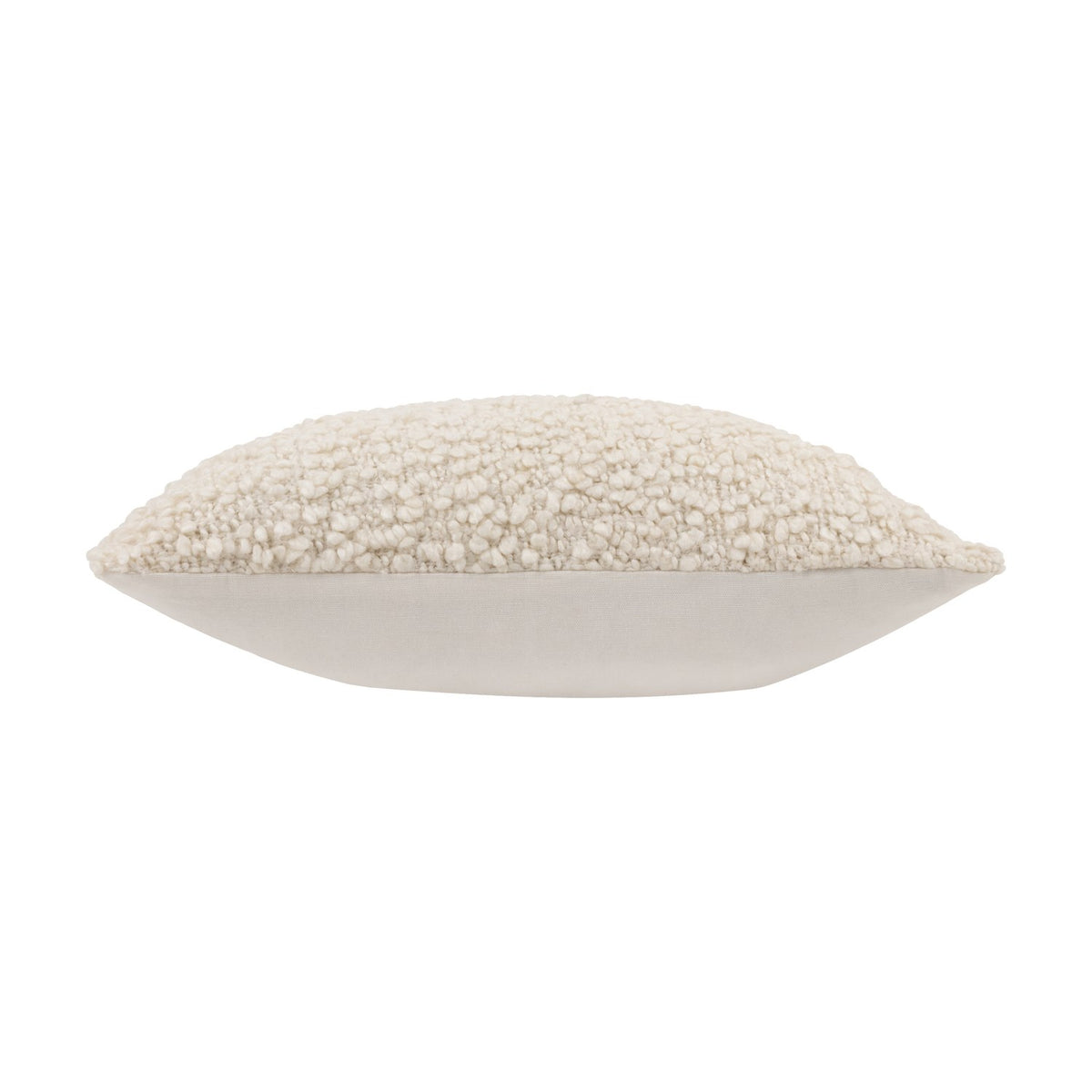 Side view of the Ulsmere Wool Cotton Cushion in ecru, showing a plain cream cotton back panel beneath a textured bouclé top edge, on a white background.