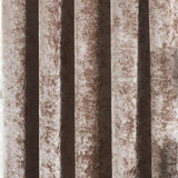 Close-up of Verona Velvet Fully Lined Eyelet Curtains in Oyster, showing deep folds and the mottled, light-catching sheen of crushed velvet fabric.