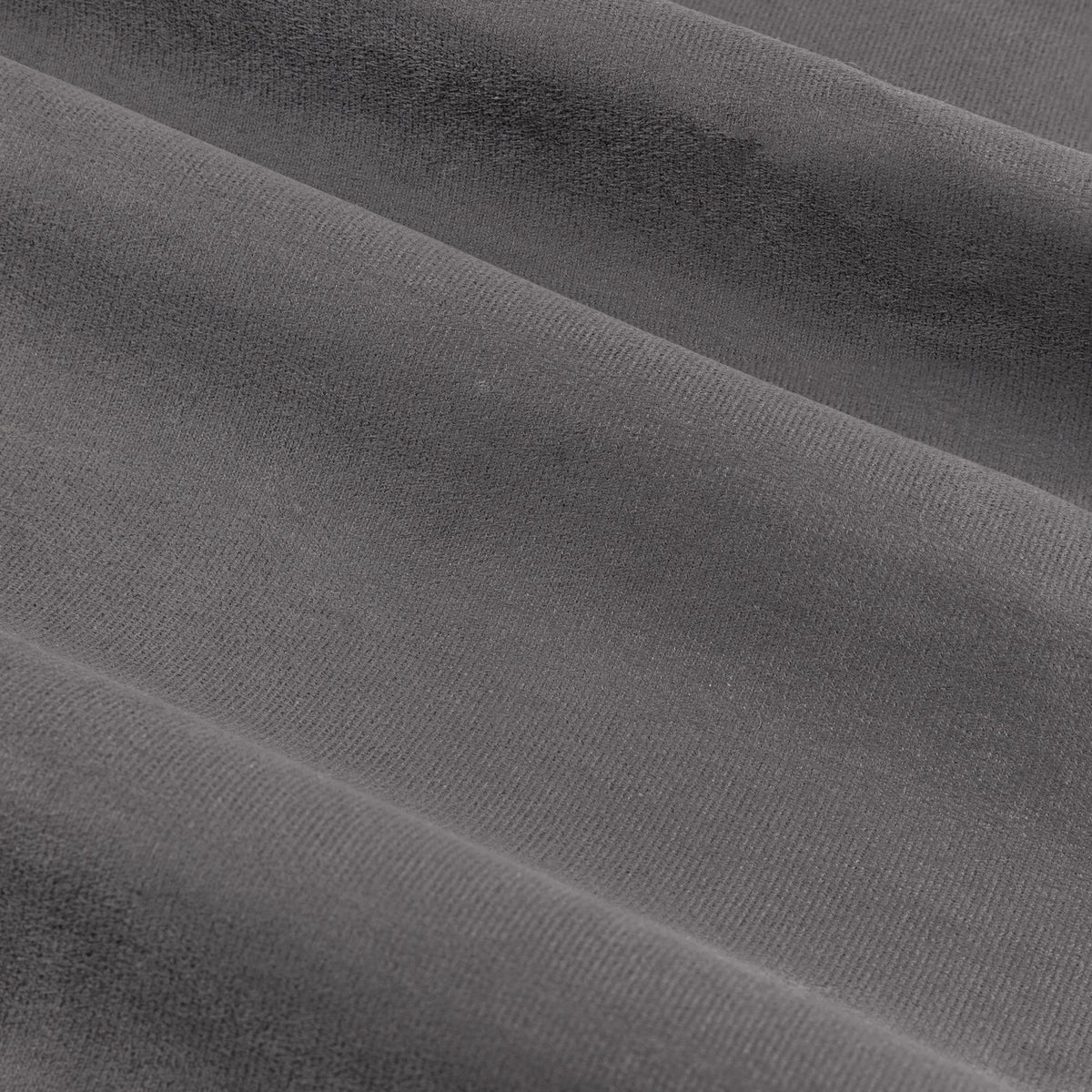 Close-up of Verso Reversible Eyelet Curtains in charcoal, showing the soft suede-effect fabric with a close pile and soft folds.