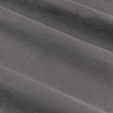 Close-up of Verso Reversible Eyelet Curtains in charcoal, showing the soft suede-effect fabric with a close pile and soft folds.
