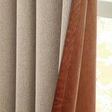 Verso Polyester Blackout Eyelet Curtains in cinnamon, close-up of folded panels showing grey outer fabric with a russet brown velvety reverse edge, beside a window.