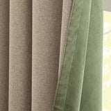 Close-up of Verso reversible eyelet curtains showing beige woven fabric on one side and green suede-effect fabric on the other, with visible seam edge.