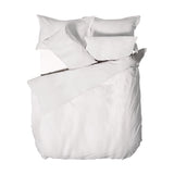 Waffle Cotton Plain Duvet Cover Set in white, showing a textured duvet with matching pillowcases arranged on a bed against a plain white background.