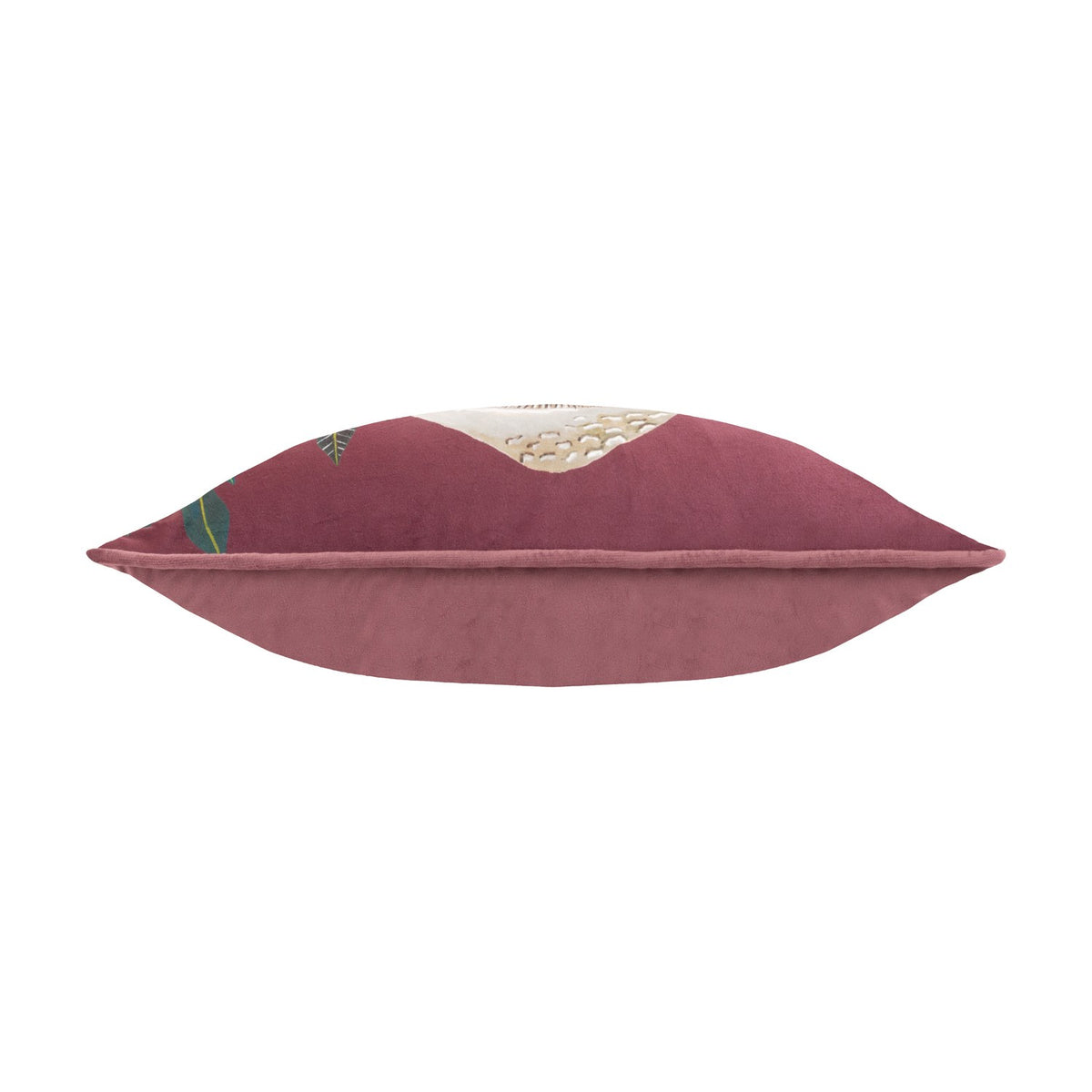 Wild Garden Floral Velvet Cushion in multicolour, side view of the bolster-style rectangle showing wine-red velvet piping and plain rose-pink reverse, shot on a white background.