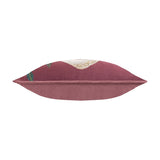 Wild Garden Floral Velvet Cushion in multicolour, side view of the bolster-style rectangle showing wine-red velvet piping and plain rose-pink reverse, shot on a white background.
