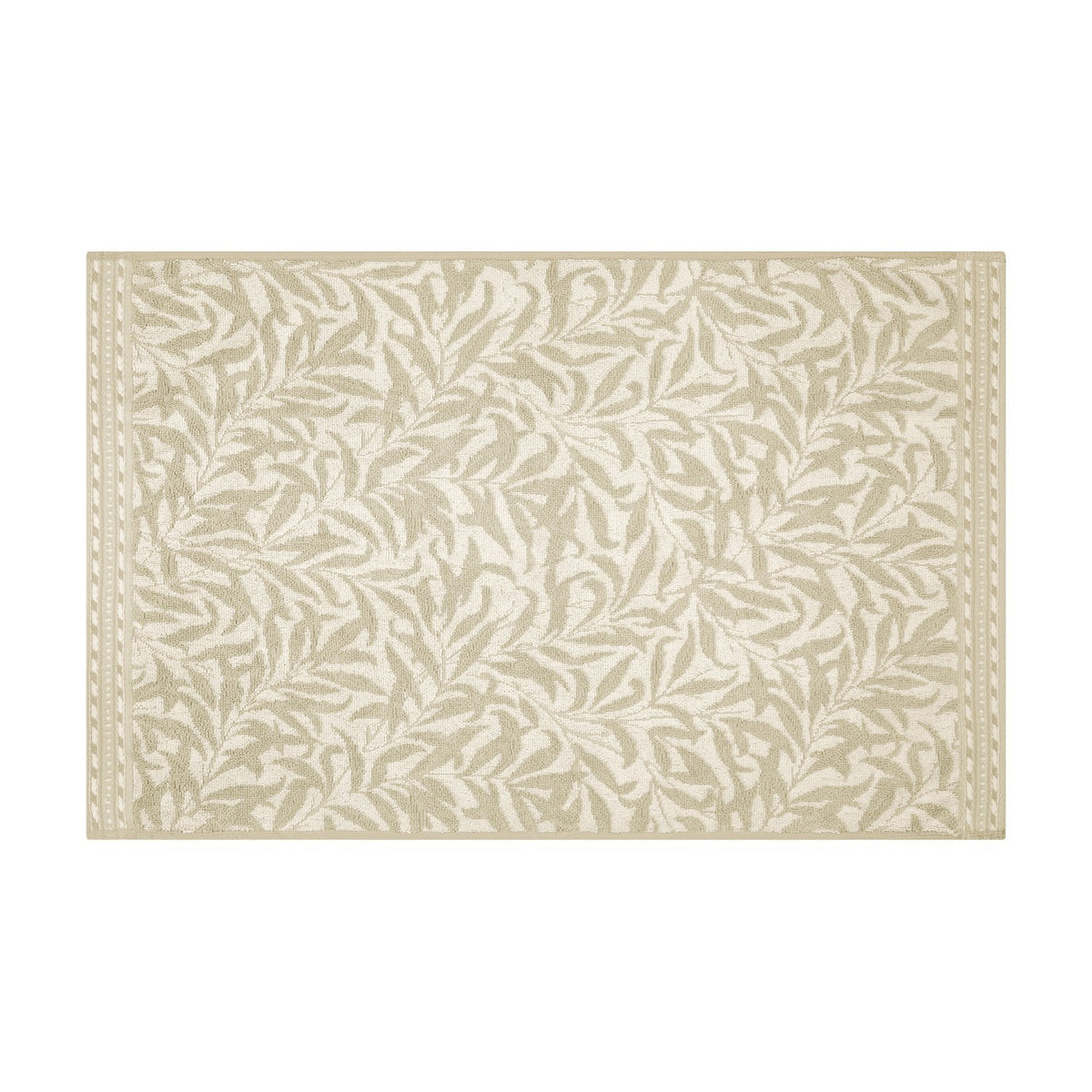 Willow Boughs cotton bath mat in natural, featuring a sandy beige trailing leaf pattern with a dotted border on off-white ground, shown on a plain white background.