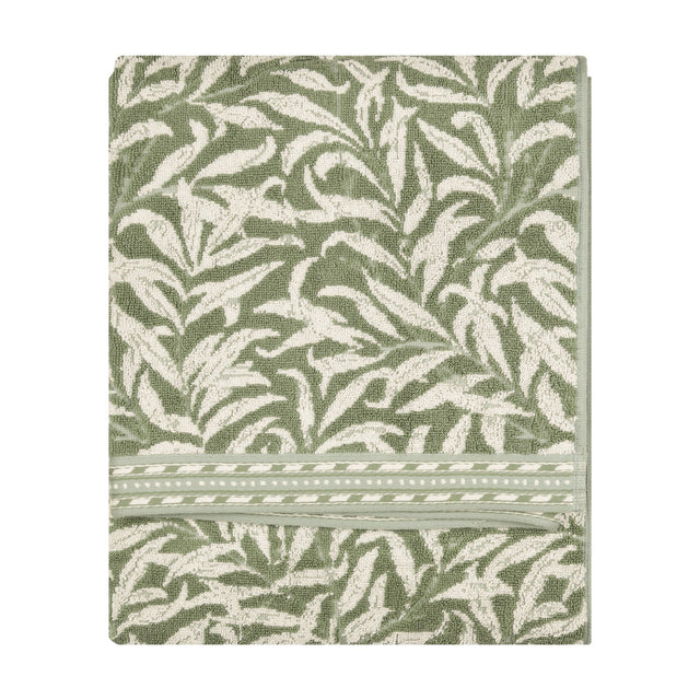 Folded Willow Boughs jacquard cotton towel in sage green with a trailing willow leaf pattern and striped border, shown on a plain white background.