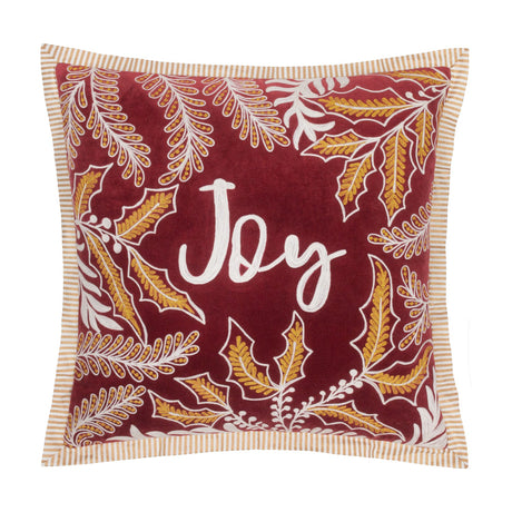 Winter Joy Velvet Cotton Cushion in red, embroidered with gold and white leaf motifs framing "Joy" in white script, striped cream and gold edge trim, shown on a white background.