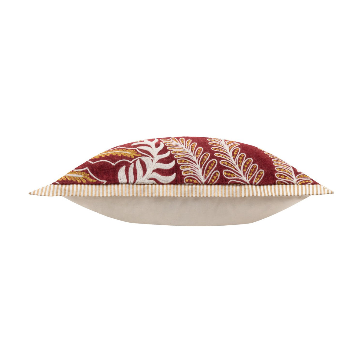 Winter Joy velvet cotton cushion in red, side view showing cream piped edge and plain back panel, front embroidered with gold and white leaf motifs on white background.