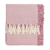 Wisley Herringbone Polyester Throw in heather pink, folded with cream tasselled fringe on one edge, shown on a plain white background.