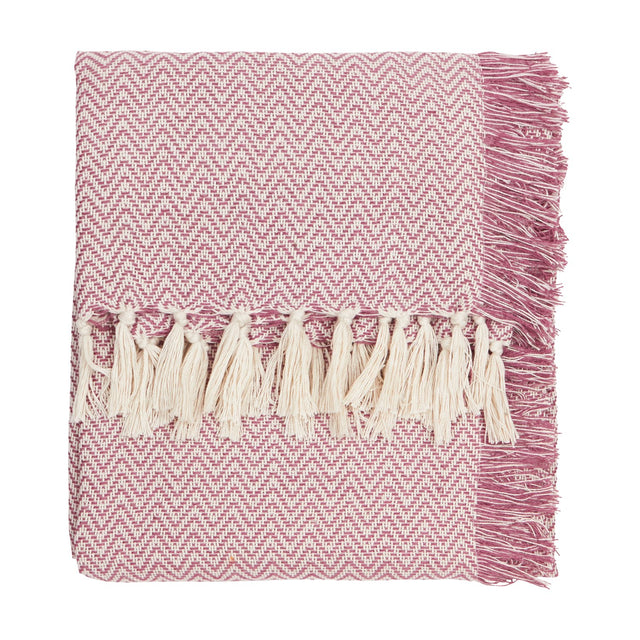 Wisley Herringbone Polyester Throw in heather pink, folded with cream tasselled fringe on one edge, shown on a plain white background.