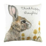 Square linen cushion with a hand-painted woodland hare in profile, "Think happy thoughts!" script above and yellow dandelions along the base, on a pale background.