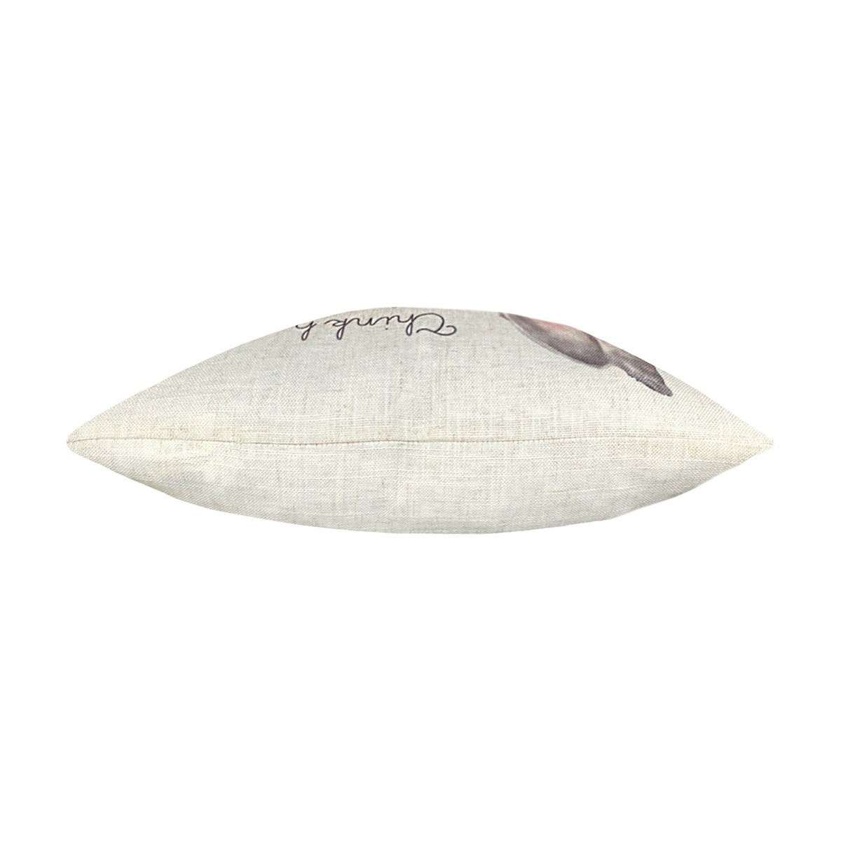 Side view of the Woodland Animal Linen Cushion showing its slim seam edge in natural linen with a partial hare motif and script visible, on a plain white background.