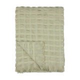 Walton Waffle Check Polyester Throw in sage, folded to show its textured grid weave and fringed edge trim against a plain white background.