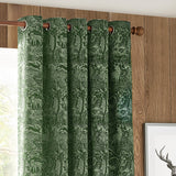 Winter Woods Chenille Lined Eyelet Curtains in emerald, showing woodland deer and forest jacquard fabric with eyelet header on a wooden curtain pole.
