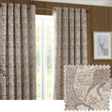 Winter Woods eyelet curtains in taupe chenille jacquard with woodland animal and tree pattern, hung on a wooden pole in front of a window, with fabric swatch shown inset.