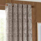 Winter Woods eyelet curtains in taupe chenille jacquard with woodland animal and tree motifs, shown hung on a wooden rod against a wood-panelled wall.