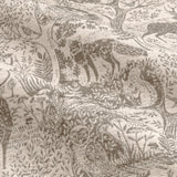 Close-up of Winter Woods eyelet curtain fabric in taupe, showing a woven chenille jacquard pattern of deer, hares, birds and trees on a pale ground.