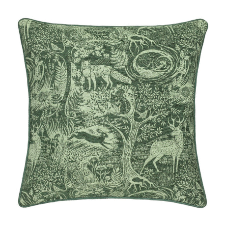 Winter Woods Jacquard Chenille Cushion in emerald green, a square design woven with forest animals including a fox, hare, stag and squirrel among trees and ferns, shown on a white background.
