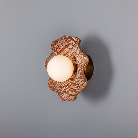 Rivale Ceramic Globe Wall Light IP44 in Red Iron, a wavy-rimmed ceramic dish with crackled rust-red glaze and a single opal glass globe, shown on a plain grey background.
