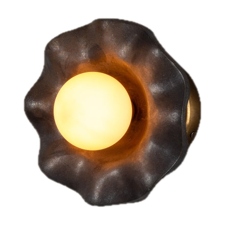 Rivale Ceramic Globe Wall Light in Metallic Earth finish, featuring a deep ruffled ceramic shade with a glowing opal glass globe centred within, shown on a plain white background.