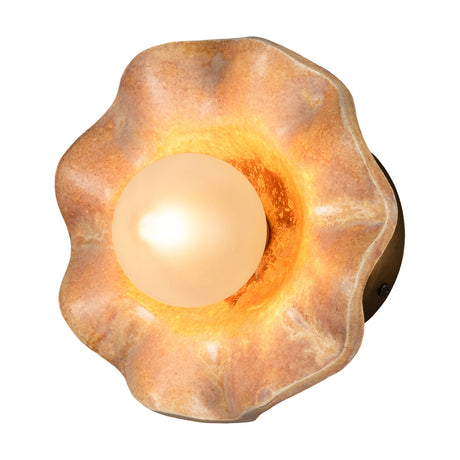 Rivale Ceramic Globe Wall Light in Oatstone, a ruffled petal-shaped ceramic shade with glowing opal glass globe and brass backplate, shown on a white background.