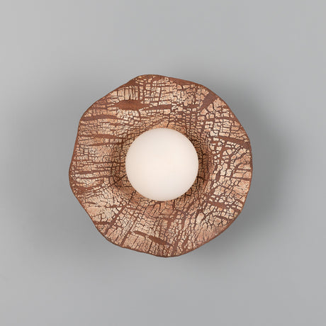 Rivale Ceramic Globe Wall Light in Red Iron, a crackled red-brown and cream ceramic shade with wavy edges around a white glass globe, shown from above on a plain grey background.