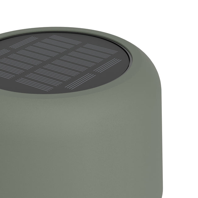 Close-up of the Roccanova-L solar LED floor lamp's cylindrical head in dark sage, showing the integrated solar panel and steel construction against a white background.