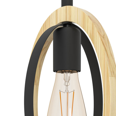 Close-up of the Rolmanne pendant light showing the black steel E27 lamp holder with an Edison bulb inside an oval light wood ring and inner black band, on a plain white background.