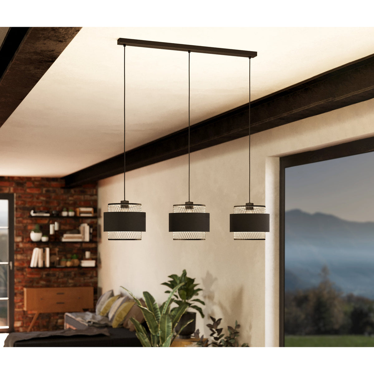 Ronarne Fabric Linear Pendant Light in black, with three drum shades and diamond-mesh tiers on a black steel bar, shown above a living room seating area.