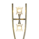 The Rosa Del Desierto 2 Light Floor Lamp in Antique Brass features two vertically aligned square glass shades on conical brass fixtures within a curved brass frame, elegantly displayed against a white background.