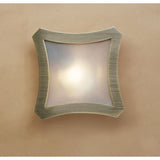 Mantra Rosa Del Desierto flush ceiling light with antique brass four-lobe frame and frosted glass shade, mounted on a warm neutral wall.