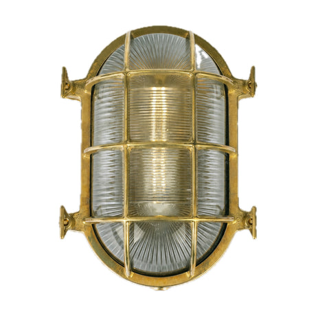 Ross Bulkhead oval wall light in brass with ribbed glass cover, protective cage, and four mounting lugs, IP54 rated, shown on a plain white background.