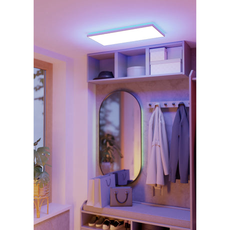 Rovito Smart LED Panel Light, 57 x 30cm, white rectangular ceiling fixture with colour-changing edge glow, shown mounted in a hallway above a mirrored storage unit.