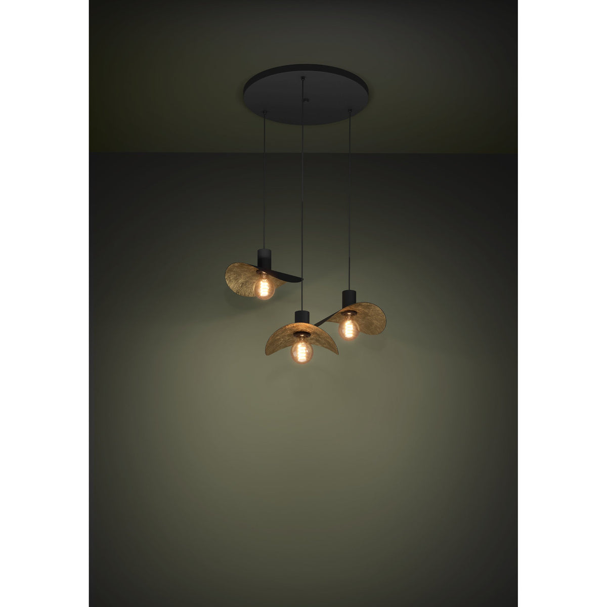 Saceda 3 Light Pendant in black and gold, round ceiling plate with three cords holding wavy hat-shaped shades, matt black outside and gold-leaf textured inside, shown lit against a dark room setting.