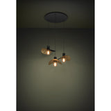 Saceda 3 Light Pendant in black and gold, round ceiling plate with three cords holding wavy hat-shaped shades, matt black outside and gold-leaf textured inside, shown lit against a dark room setting.
